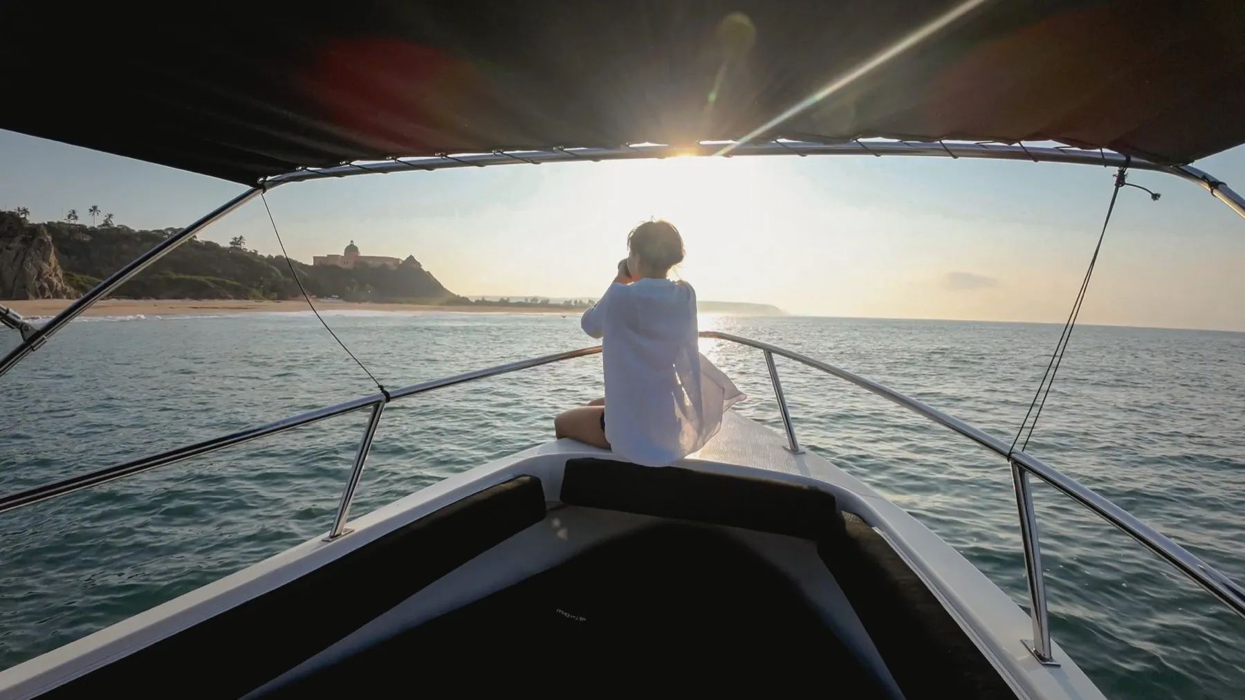 Boat ride along the coast at golden hour