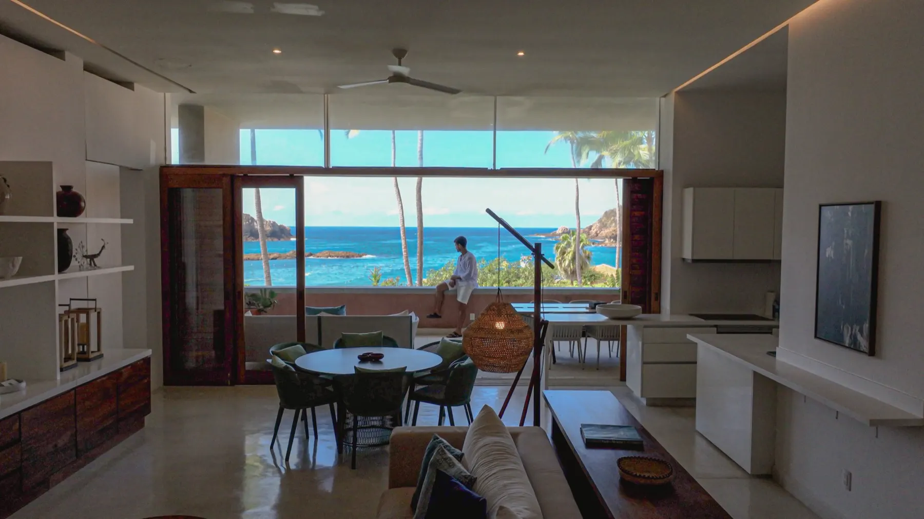 Open living and kitchen space with a wide window to the Pacific