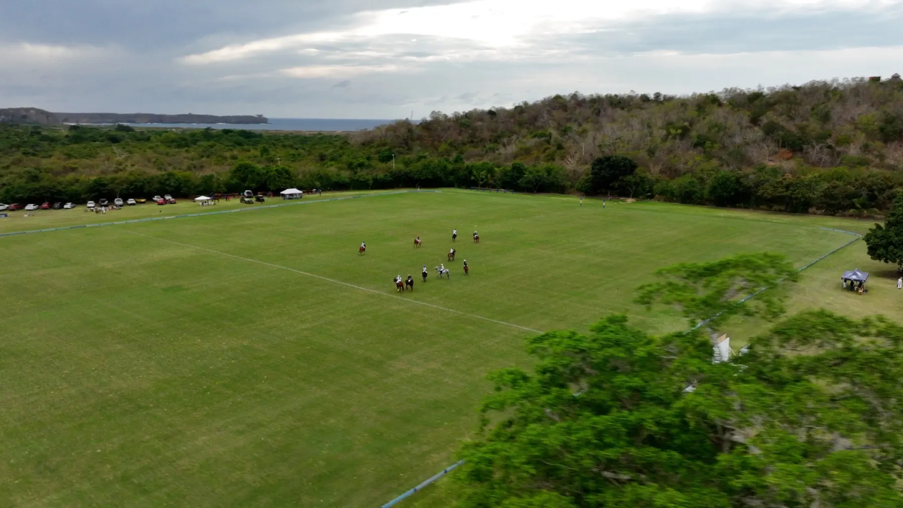 Polo match on a green field in Careyes