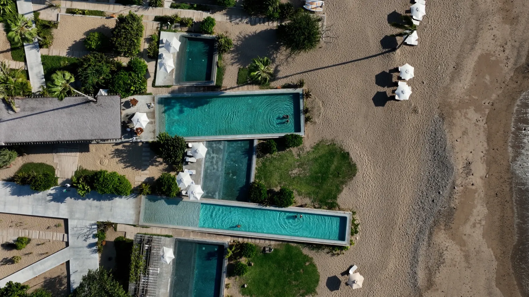 Aerial view of the oceanfront infinity pools at El Careyes Club & Residences