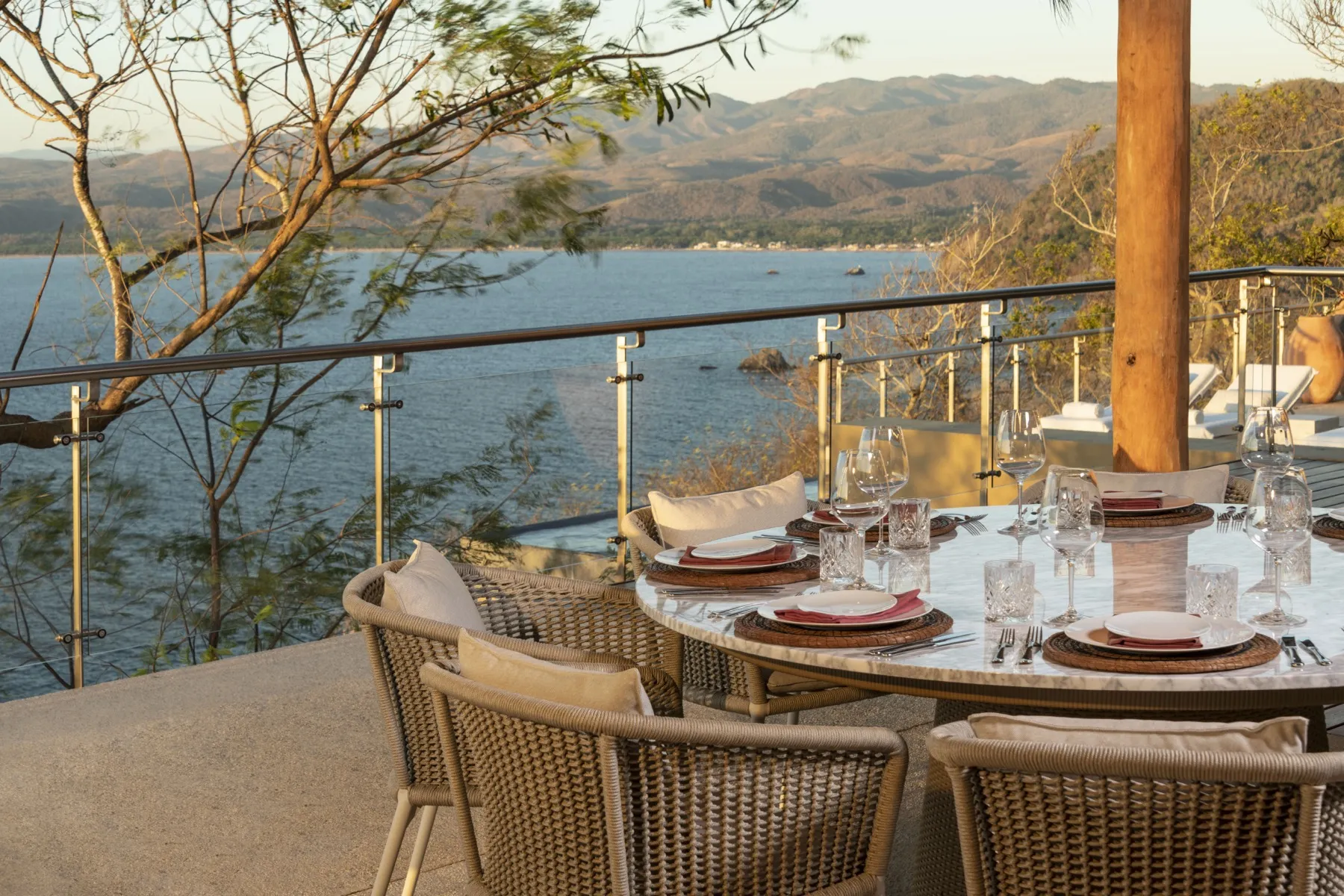 Open-air dining under a palapa at a Las Alturas villa