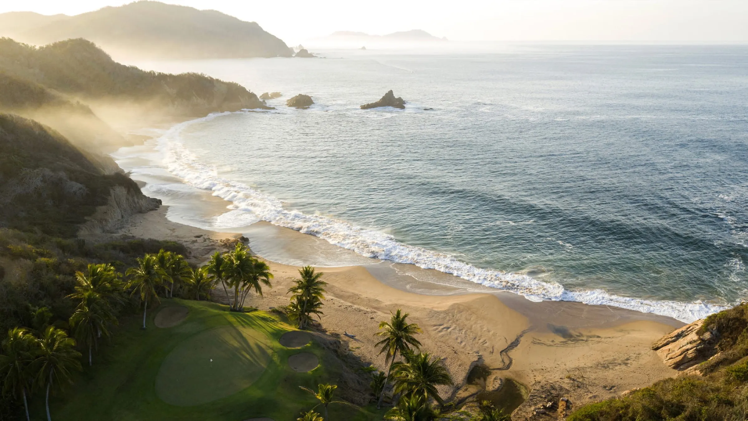 The Tamarindo coastline at first light, with jungle meeting the Pacific